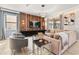 The modern living room features stylish furniture, a large TV, and decorative lighting fixtures at 1456 Belle Terre Rd, Davenport, FL 33896