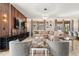 Open-concept living room featuring stylish decor, modern lighting, and a comfortable seating area at 1456 Belle Terre Rd, Davenport, FL 33896