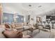 Spacious open concept living area with dining, kitchen and living room under modern lighting at 1456 Belle Terre Rd, Davenport, FL 33896