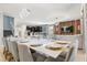 Bright and airy living space featuring dining area, kitchen, and a cozy living room with modern decor at 1456 Belle Terre Rd, Davenport, FL 33896