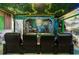Home theater room featuring plush seating and themed decor at 1456 Belle Terre Rd, Davenport, FL 33896