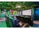 Home theater room with comfortable seating and immersive screen at 1456 Belle Terre Rd, Davenport, FL 33896