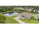 Beautiful aerial view of the property showcasing the house, pond, and well-manicured landscaping at 1504 Cordgrass Way, Lakeland, FL 33813