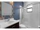 Stylish bathroom featuring modern fixtures, a glass-enclosed shower, and decorative tiling, all under modern lighting at 1504 Cordgrass Way, Lakeland, FL 33813