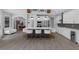 Open kitchen featuring a large island, seating, stainless steel appliances, and a wine fridge at 1504 Cordgrass Way, Lakeland, FL 33813