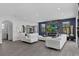 Bright living room featuring modern fireplace, large windows, and stylish decor at 1504 Cordgrass Way, Lakeland, FL 33813