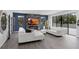 Bright living room with fireplace, large windows, and access to outdoor space at 1504 Cordgrass Way, Lakeland, FL 33813