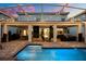 Spacious backyard with a pool, patio, grill, string lights and plenty of room for outdoor entertainment at 1560 Maidstone Ct, Davenport, FL 33896