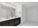 Spacious bathroom featuring dual sinks, modern fixtures, and ample counter space at 1560 Maidstone Ct, Davenport, FL 33896