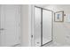 Modern bathroom featuring a stand-up shower with frameless glass doors at 1560 Maidstone Ct, Davenport, FL 33896