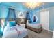 Charming bedroom with unique light fixtures and themed decor at 1560 Maidstone Ct, Davenport, FL 33896