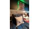 This bedroom includes decorative pillows, a bedside table and a cartoon-themed background at 1560 Maidstone Ct, Davenport, FL 33896