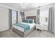 Modern bedroom featuring stylish gray decor and elegant bedside pendant lights at 1560 Maidstone Ct, Davenport, FL 33896