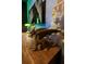 Bedroom with a dragon on a wooden desk and a colorful mural on the wall at 1560 Maidstone Ct, Davenport, FL 33896