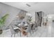 Modern dining area with decorative art and comfortable seating at 1560 Maidstone Ct, Davenport, FL 33896