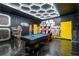 Themed game room featuring a pool table and themed decorations, for endless entertainment at 1560 Maidstone Ct, Davenport, FL 33896