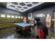 Fun game room featuring a pool table, painted walls, and themed decor at 1560 Maidstone Ct, Davenport, FL 33896