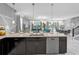 Open-concept kitchen with stainless steel appliances, a large island, and pendant lighting at 1560 Maidstone Ct, Davenport, FL 33896