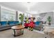 Bright and airy living room with comfortable seating and view into the dining area at 1560 Maidstone Ct, Davenport, FL 33896