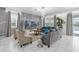 Open living space with tile floors, stylish furniture, and seamless flow at 1560 Maidstone Ct, Davenport, FL 33896