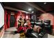 Themed theater room featuring cozy seating and fun character decorations, for entertainment at 1560 Maidstone Ct, Davenport, FL 33896