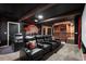 Home theater with plush seating, a large screen, and themed decor providing an immersive entertainment experience at 1560 Maidstone Ct, Davenport, FL 33896