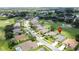 Gorgeous aerial view showing the house's location within a lush golf course community with scenic views and spacious surroundings at 1590 The Oaks Blvd, Kissimmee, FL 34746