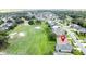 Picturesque aerial view of the house emphasizing its convenient location near the golf course and well-kept surroundings at 1590 The Oaks Blvd, Kissimmee, FL 34746