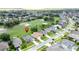 Captivating aerial shot showcasing the home's location in a golf course community with beautifully maintained lawns and landscaping at 1590 The Oaks Blvd, Kissimmee, FL 34746