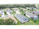 Aerial view of a neighborhood with a golf course at 1590 The Oaks Blvd, Kissimmee, FL 34746