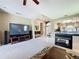 Bright living room featuring an electric fireplace, carpet and open floorplan at 1590 The Oaks Blvd, Kissimmee, FL 34746