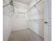 Spacious walk-in closet offers ample storage with wire shelving, perfect for organizing your wardrobe at 1590 The Oaks Blvd, Kissimmee, FL 34746