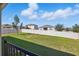 Fenced backyard featuring green lawn, providing a safe and private area for outdoor enjoyment at 168 Jensen Dr, Groveland, FL 34736