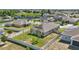 Birds eye view of fenced-in backyard with green lawn and stone walkway, offering a serene and private outdoor space at 168 Jensen Dr, Groveland, FL 34736