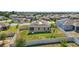 Aerial view of a well-maintained backyard with white fence and lush green lawn, providing a private outdoor space at 168 Jensen Dr, Groveland, FL 34736