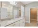 Stylish bathroom with double sinks, granite countertops, and glass-enclosed shower at 168 Jensen Dr, Groveland, FL 34736