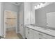 Bathroom featuring double vanity with granite countertops and a separate tub/shower combo at 168 Jensen Dr, Groveland, FL 34736