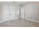 Bright bedroom featuring tile floors, closet and neutral paint, offering a clean and modern look at 168 Jensen Dr, Groveland, FL 34736