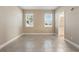 Inviting bedroom with tile floors, neutral walls, and an ensuite bathroom at 168 Jensen Dr, Groveland, FL 34736