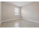 Serene bedroom with tile floors, a window, and calming wall color at 168 Jensen Dr, Groveland, FL 34736