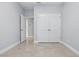 Bedroom featuring tile floors and a closet, providing practical storage and easy maintenance at 168 Jensen Dr, Groveland, FL 34736