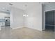 Bright dining area featuring decorative textured wall and a stylish chandelier at 168 Jensen Dr, Groveland, FL 34736