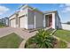 Charming home exterior with manicured landscaping and a welcoming front entrance at 168 Jensen Dr, Groveland, FL 34736