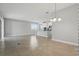Open-concept living room with ample space, tile flooring, and abundant natural light at 168 Jensen Dr, Groveland, FL 34736