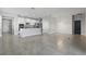 Bright and open living space featuring tile flooring and a modern kitchen at 168 Jensen Dr, Groveland, FL 34736