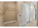 Well-organized walk-in closet featuring tile floors and shelving system at 168 Jensen Dr, Groveland, FL 34736