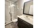 Clean bathroom featuring a single vanity, shower, and tile floors at 191 Aidans Lndg, Haines City, FL 33844