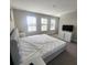 Bright bedroom featuring carpet floors, neutral walls and large windows for lots of natural light at 191 Aidans Lndg, Haines City, FL 33844