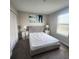 Comfortable bedroom features a plush bed, bright window, and closet at 191 Aidans Lndg, Haines City, FL 33844