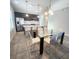 Modern eat-in kitchen featuring a large island with white countertops and a dining table with seating at 191 Aidans Lndg, Haines City, FL 33844